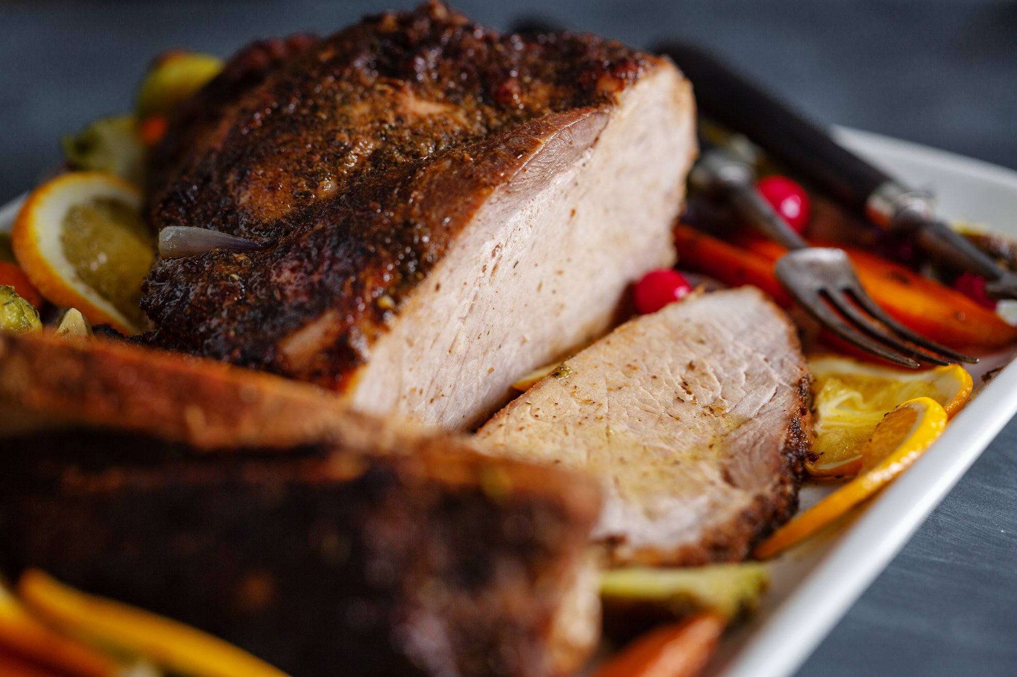 tasty-appetizing-roasted-meat-pork-with-vegetables-thanksgiving-day-closeup